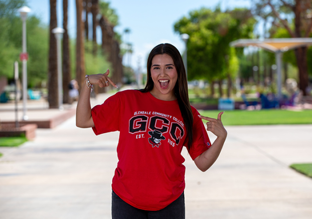 Smiling GCC Student wearing a red GCC t-shirt